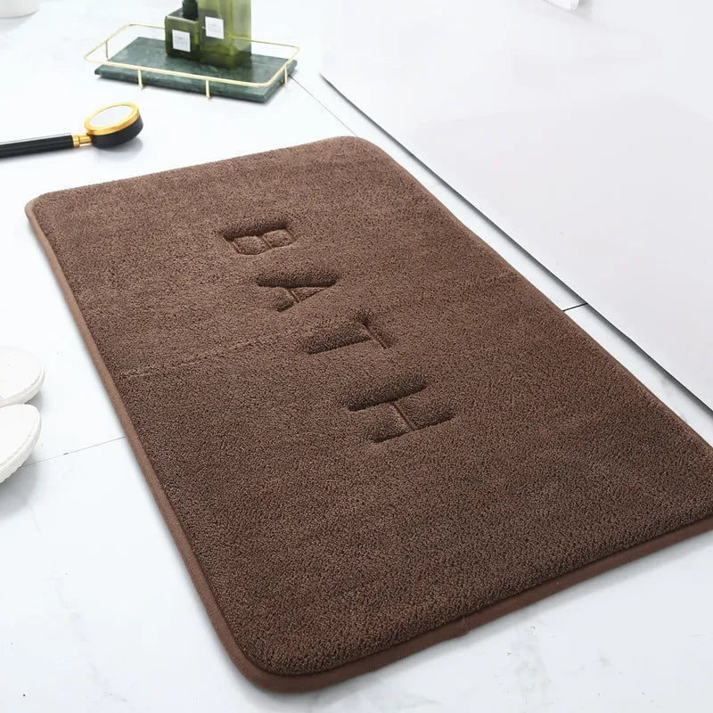 tapis de bain marron antiderapant avec motif bath