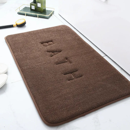 tapis de bain marron antiderapant avec motif bath
